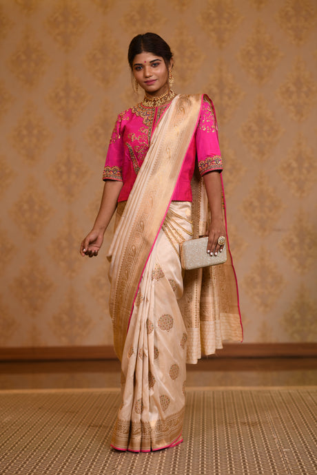 Wear Bright Pink and Ivory Saree with Zari